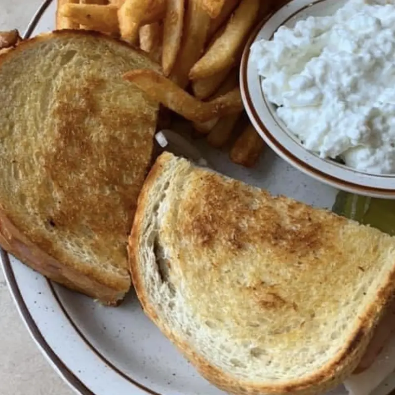 sandwich with side of cottage cheese and fries